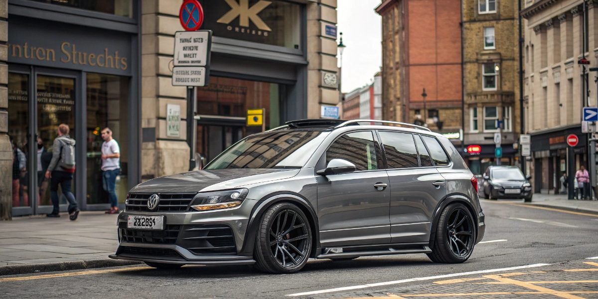 A modified new vw tiguan with aggressive body kit.jpg